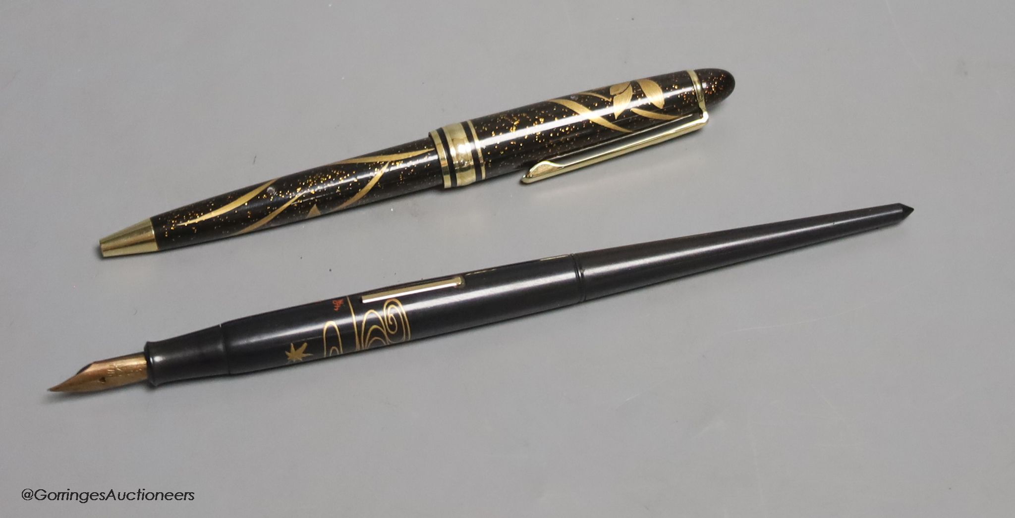 A Japanese lacquer maki-e dip style fountain pen with Dunhill Namiki nib, and a maki-e ballpoint pen